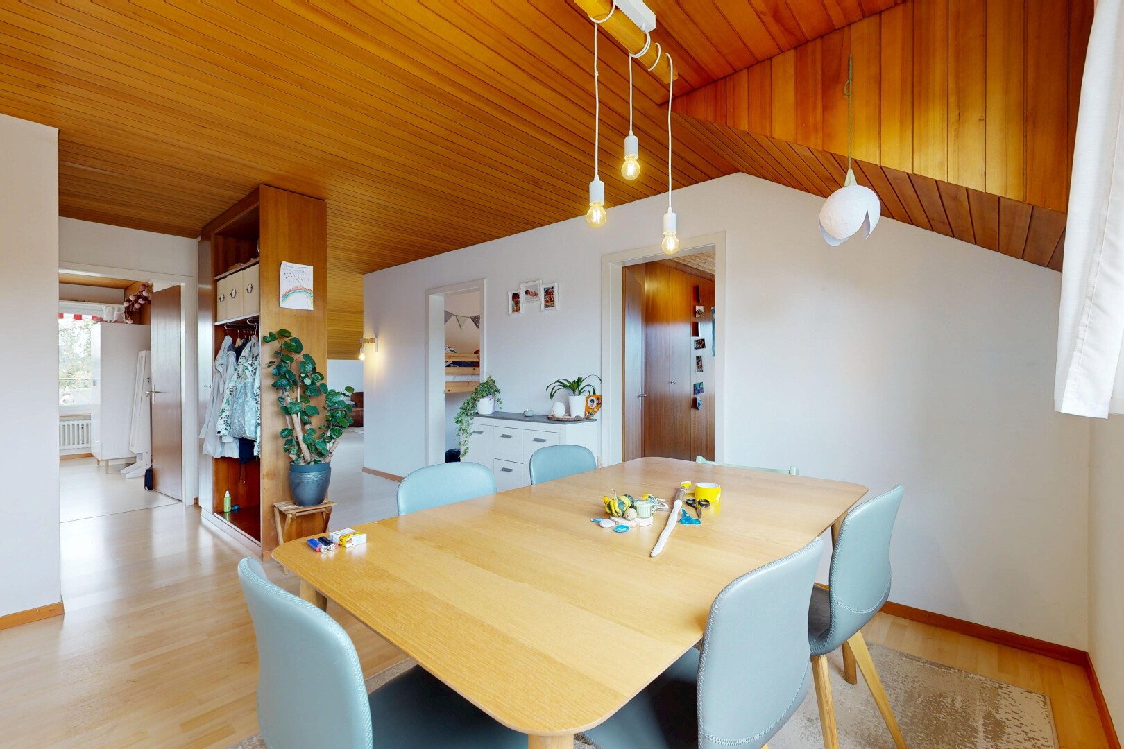 dining space featuring light wood-type flooring, wood ceiling, lofted ceiling, and radiator