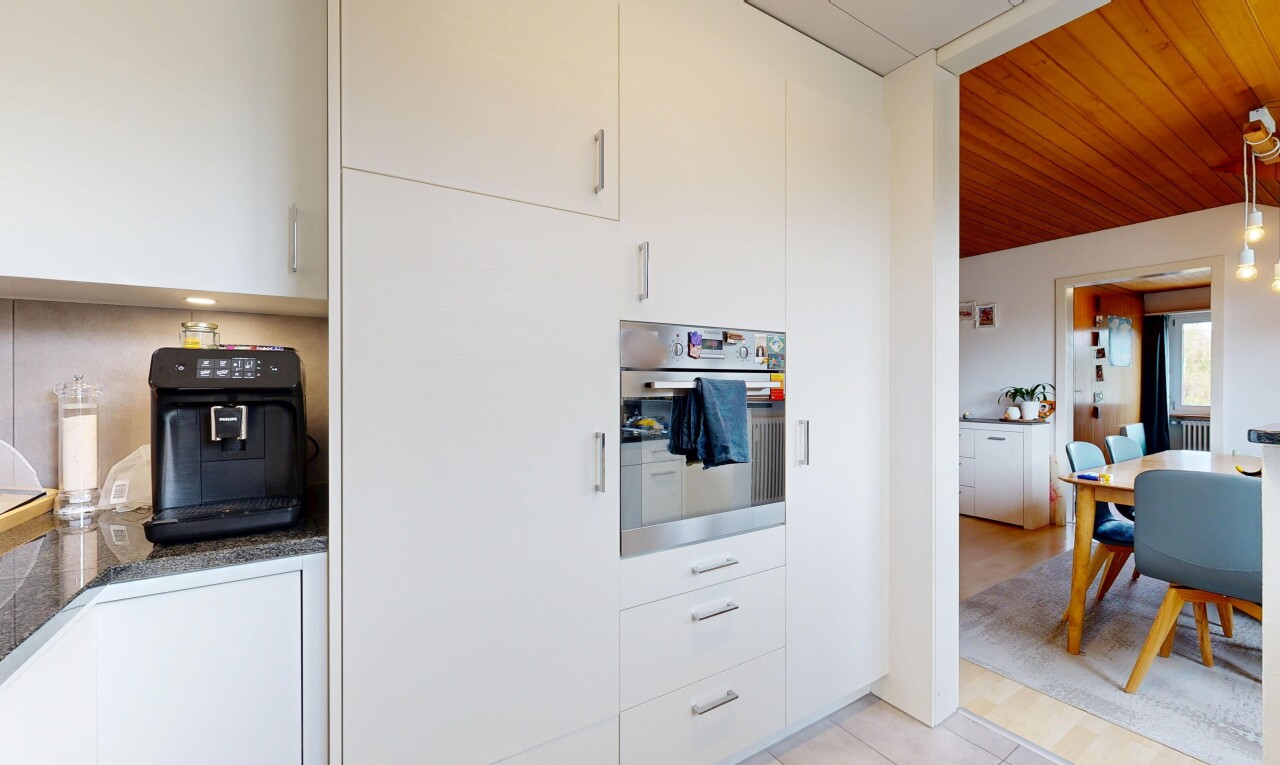 kitchen featuring white cabinetry, oven, light tile patterned floors, and wood ceiling