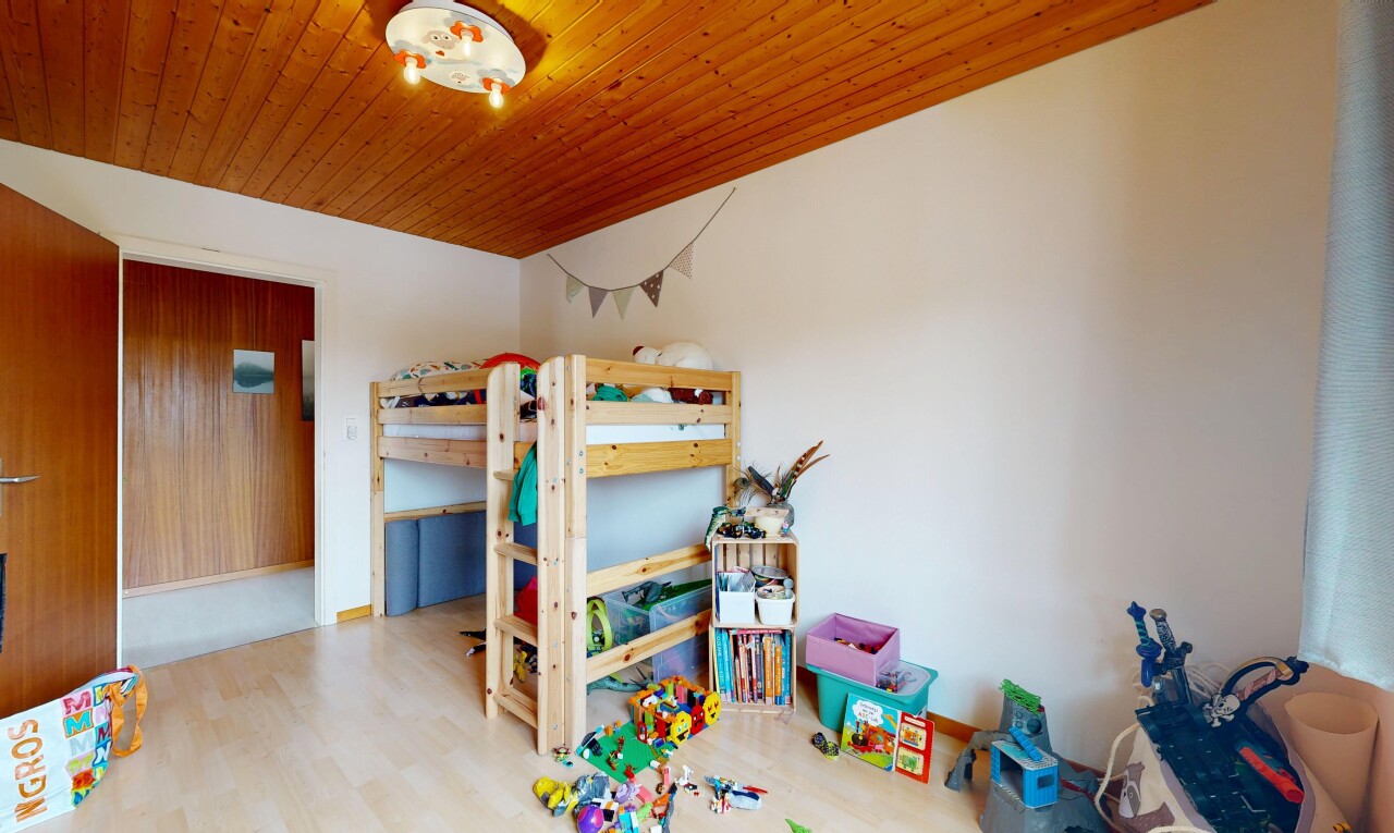 room with wood finished floors and wooden ceiling