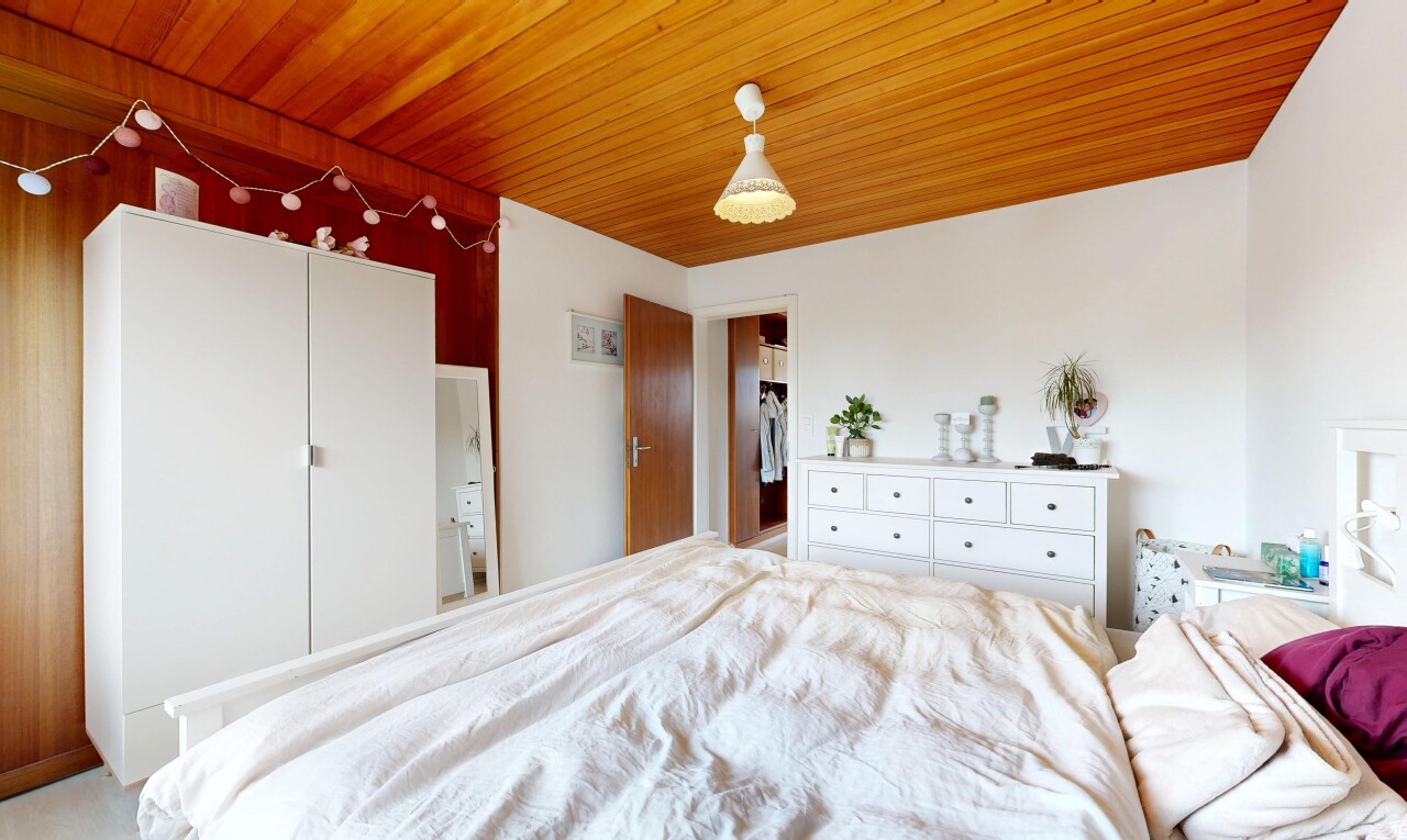 room featuring wood ceiling and a closet