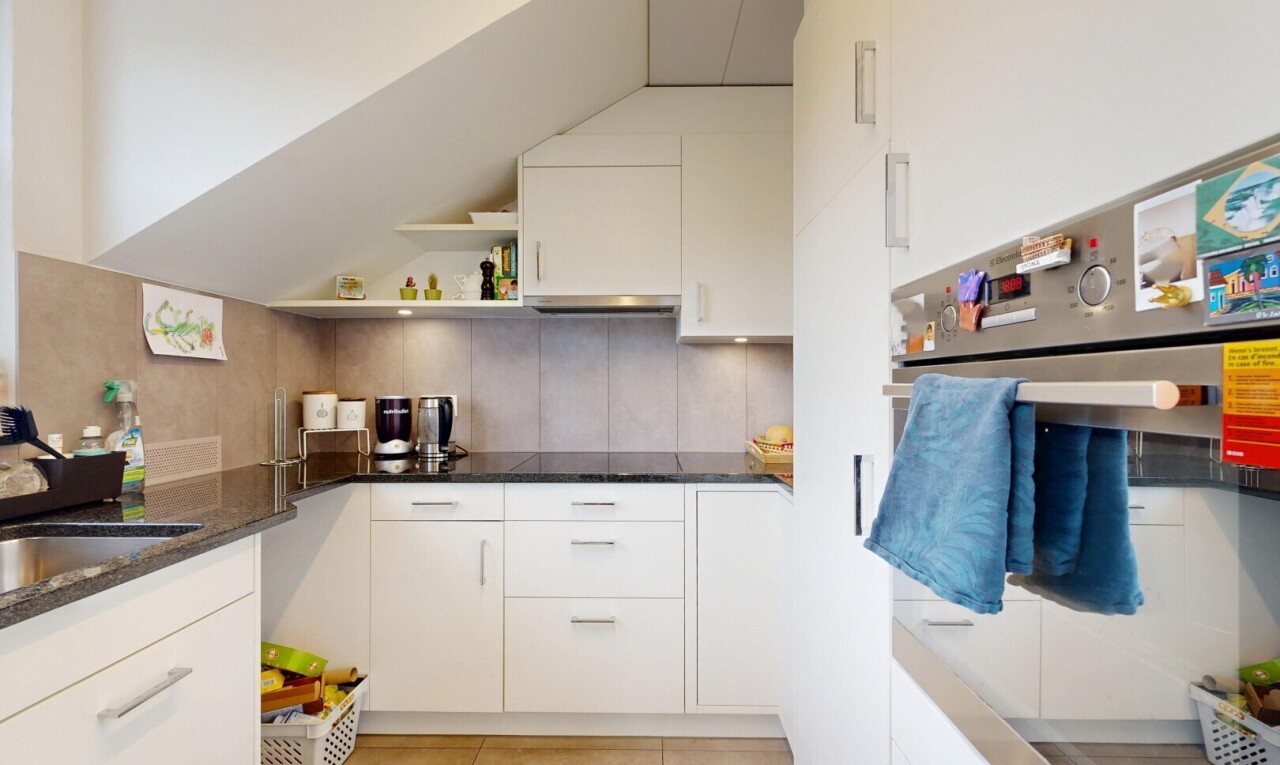 kitchen featuring open shelves, oven, white cabinetry, and decorative backsplash