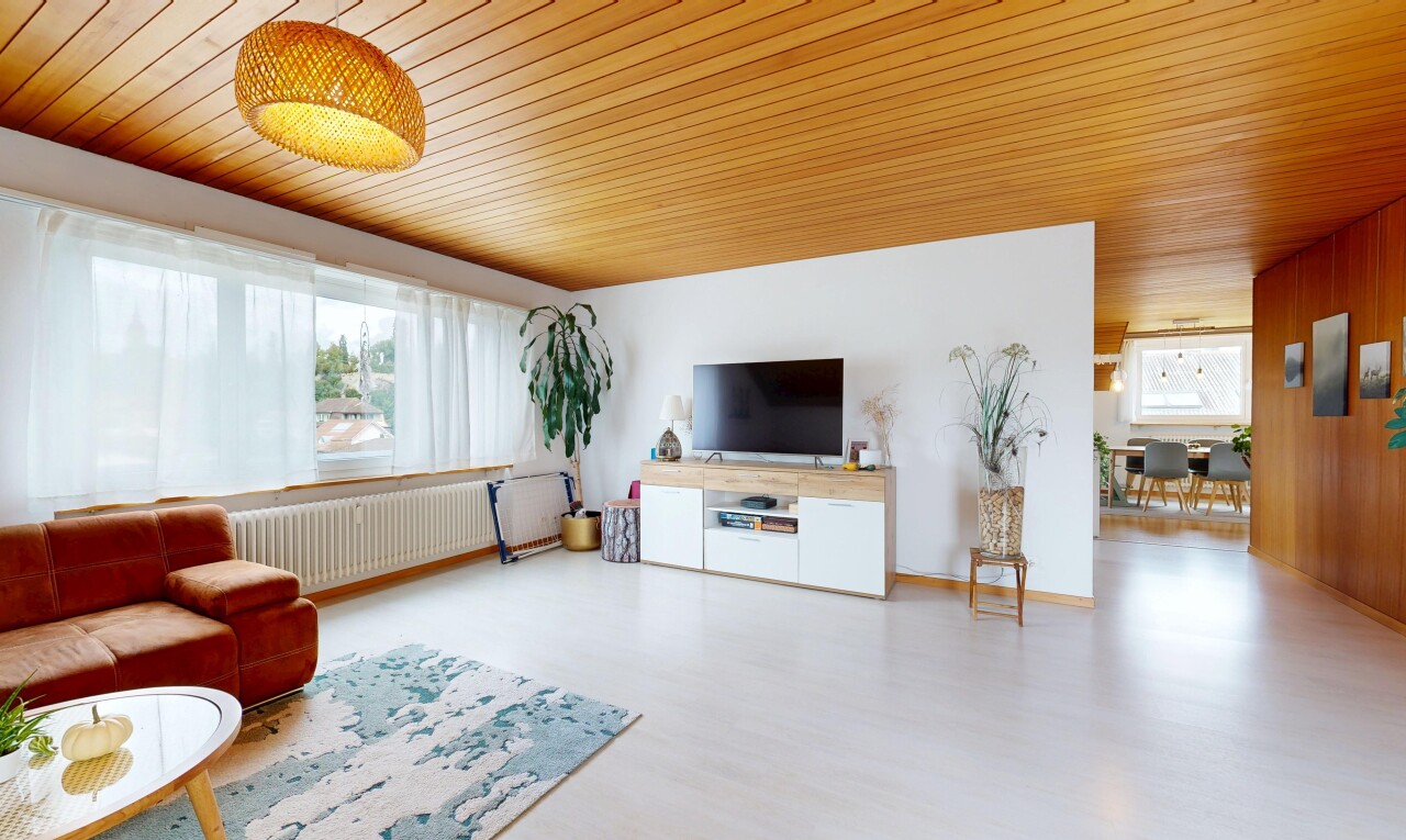 living area featuring radiator heating unit, wood ceiling, and wood finished floors
