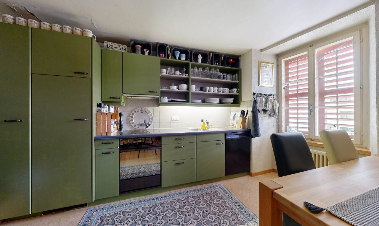 küche mit green cabinets, grüne schränke, light floor, inside property, und ofen