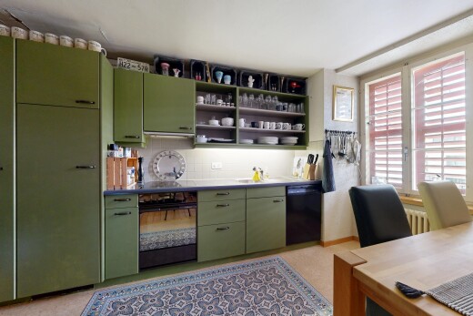 küche mit green cabinets, grüne schränke, light floor, inside property, und ofen
