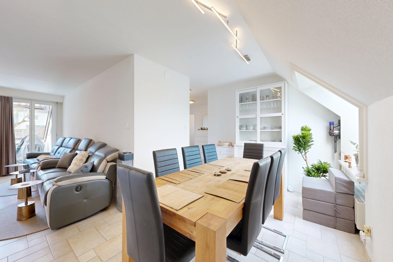 living / dining area with lofted ceiling