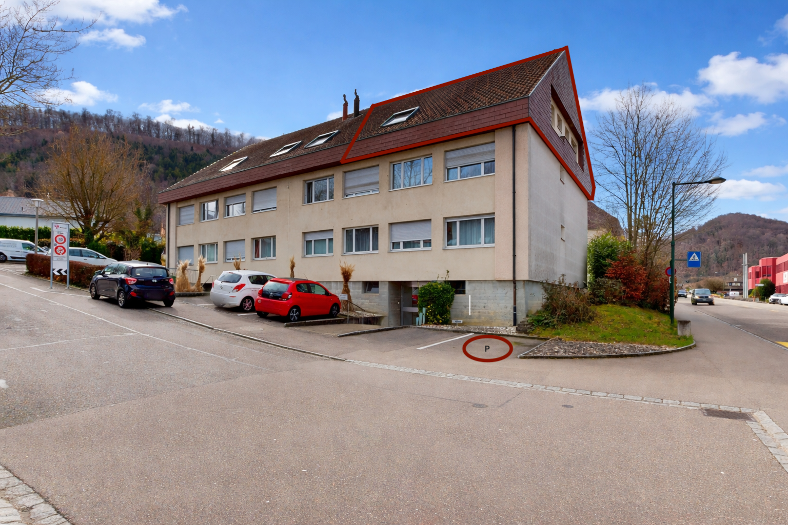 view of apartment building / complex featuring a mountain view and uncovered parking