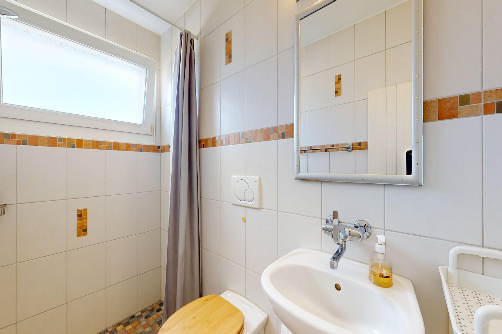 full bath with a shower stall and tile walls