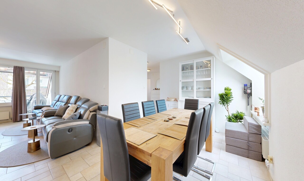 living / dining area with lofted ceiling