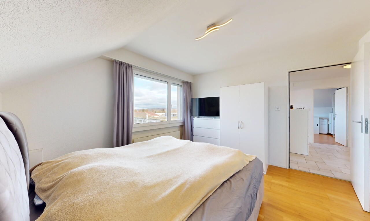 room / bedroom featuring light wood finished floors, a closet, and vaulted ceiling