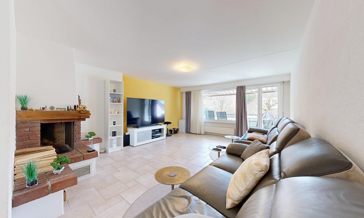 living area with stone tile floors