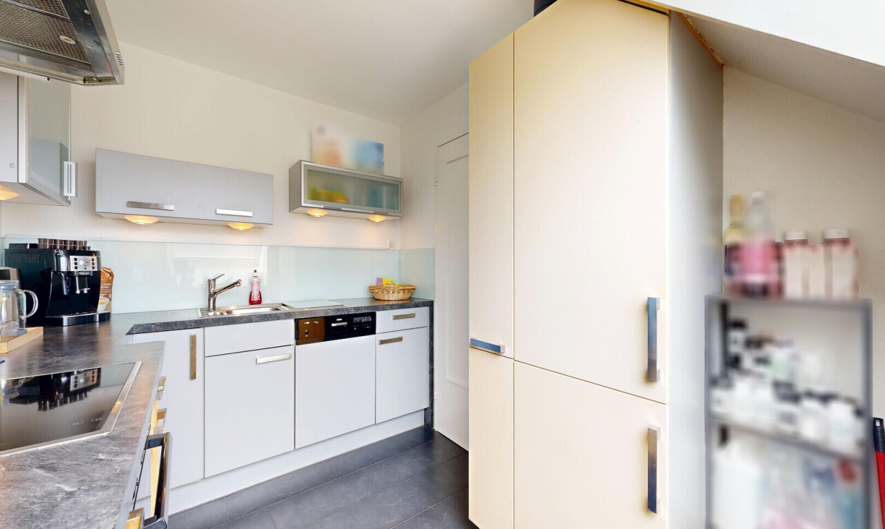 kitchen featuring open shelves, black electric stovetop, white cabinetry, white dishwasher, and dark countertops