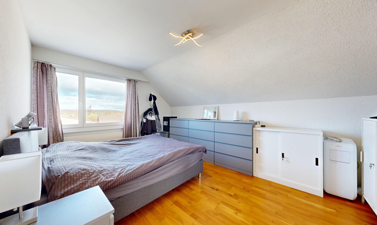 room featuring vaulted ceiling and wood finished floors