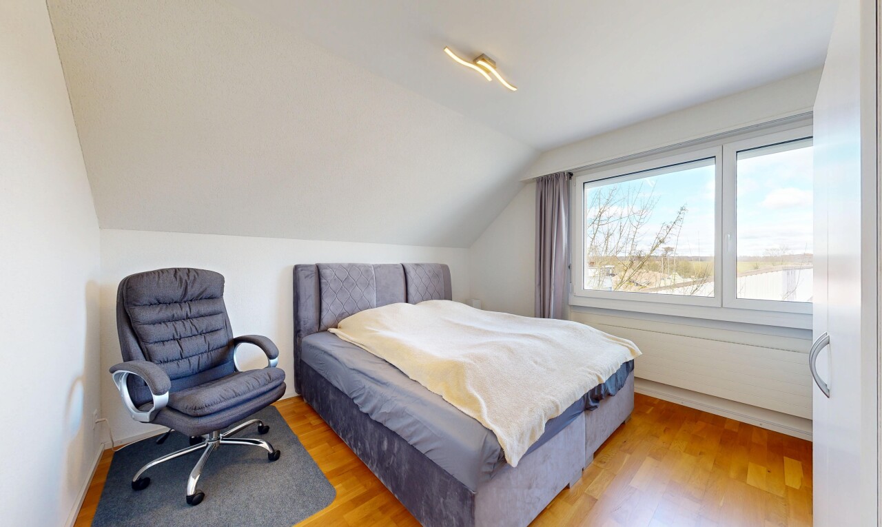 room featuring light wood-style flooring and vaulted ceiling