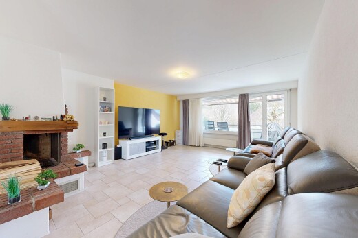 living area with stone tile floors