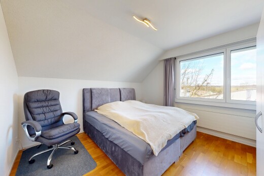 room featuring light wood-style flooring and vaulted ceiling