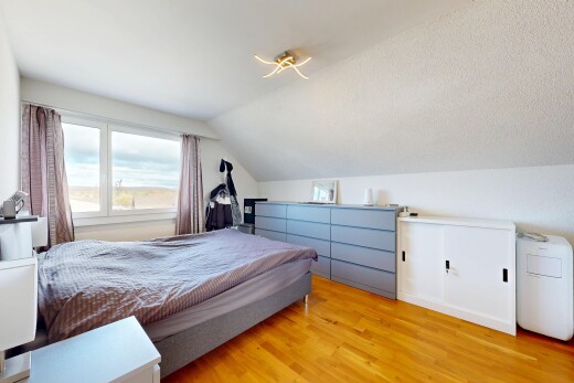room featuring vaulted ceiling and wood finished floors