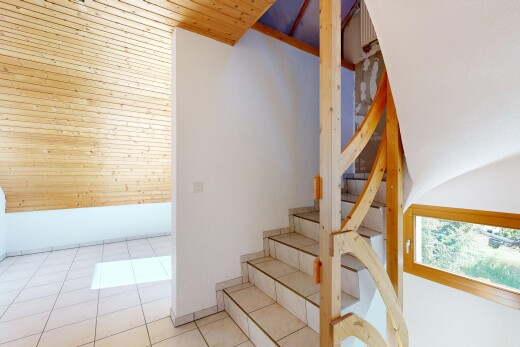 staircase featuring wooden ceiling and light tile patterned floors