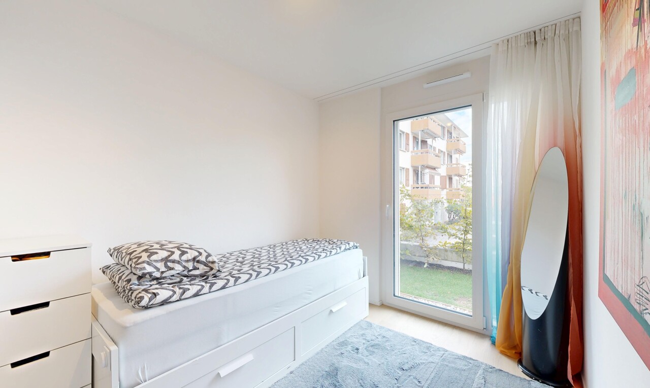 carpeted room featuring access to outside