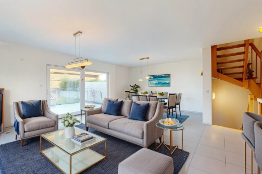 living / dining room with light tile patterned floors