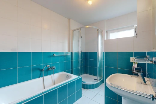 bathroom with separate shower and tub, tile patterned flooring, tile walls, and sink