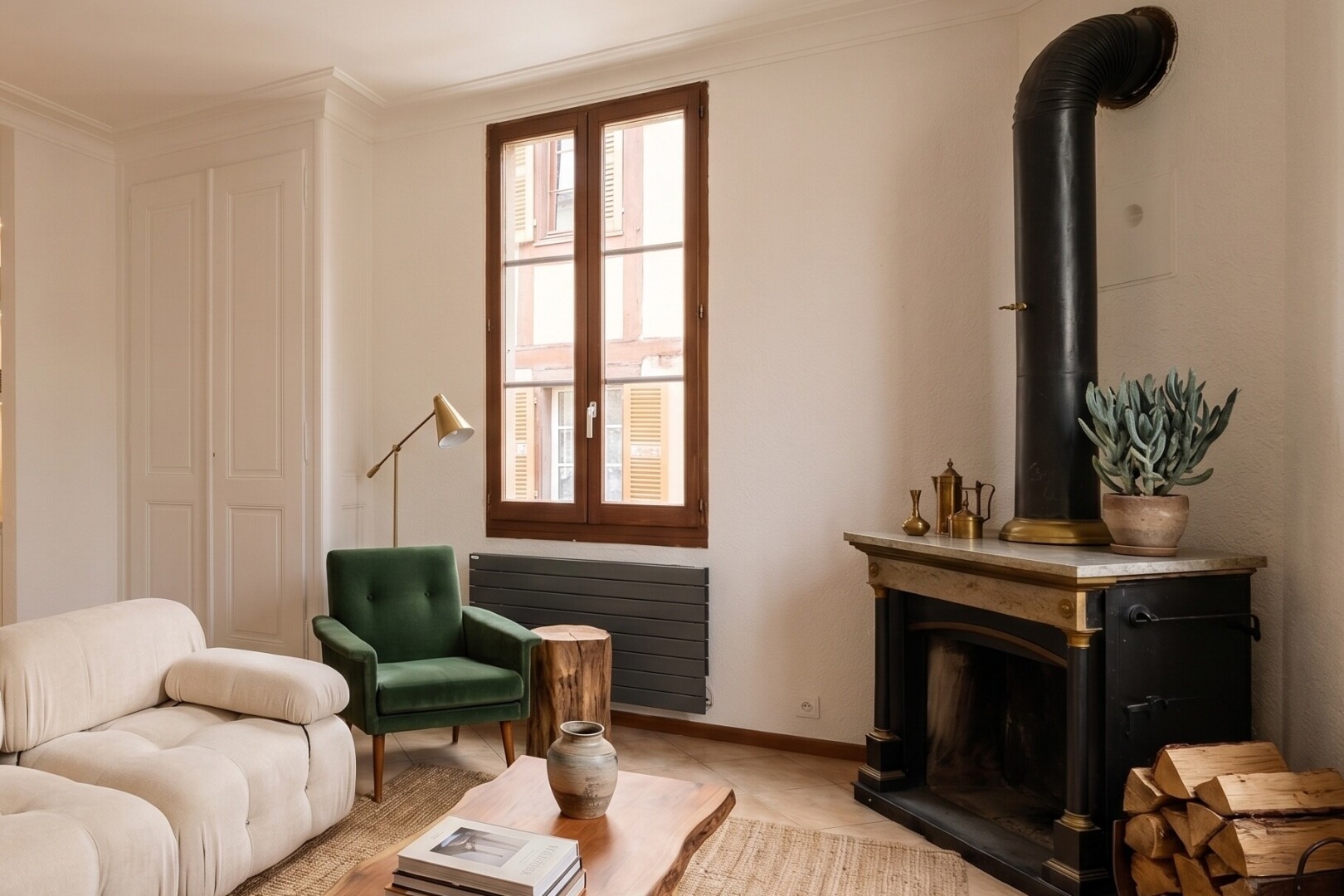 unfurnished room featuring radiator heating unit and a wood stove