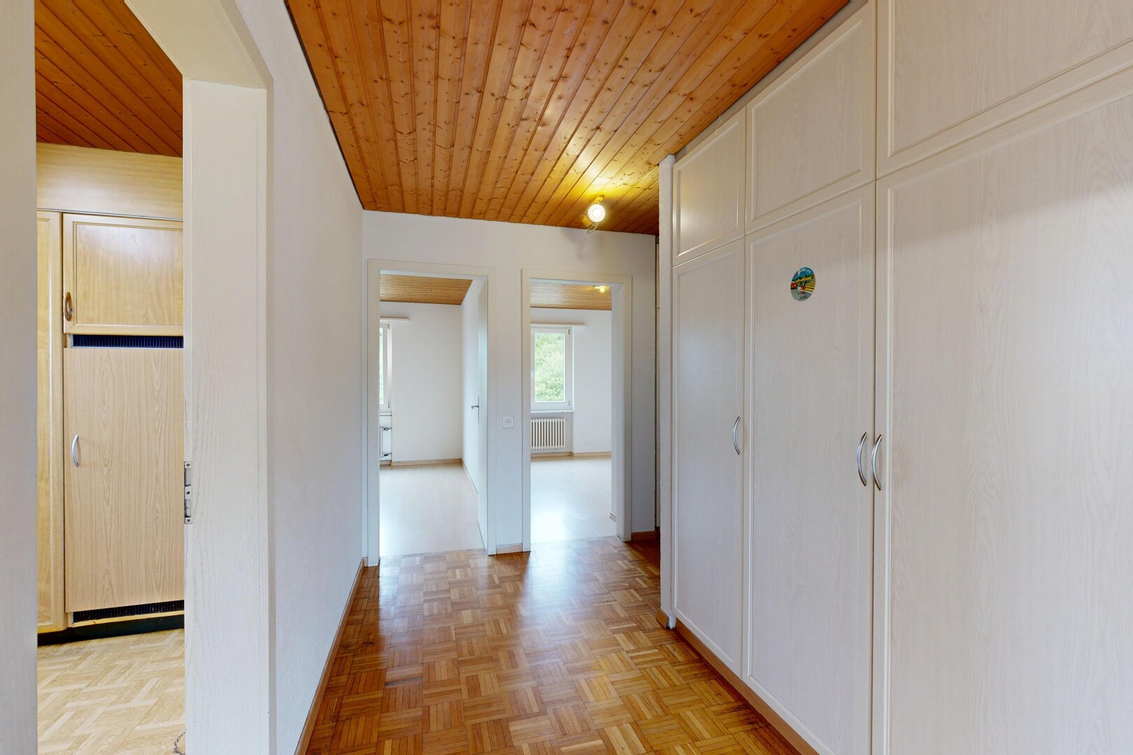 hall with wood ceiling and parquet floors