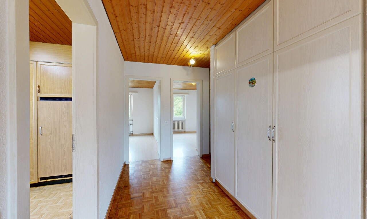 hall with wood ceiling and parquet floors