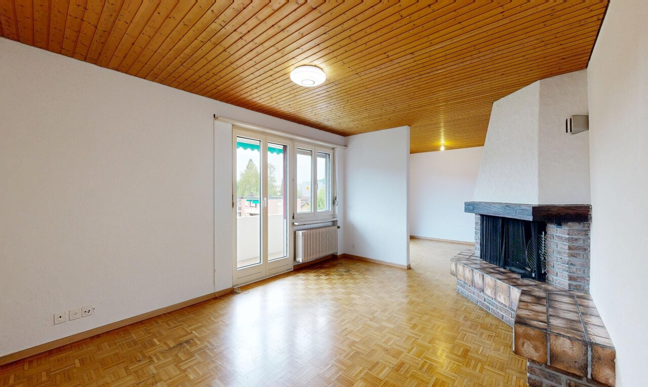empty room with a fireplace, wood ceiling, radiator heating unit, and parquet floors
