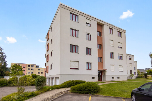 extérieur du bâtiment avec day time, vue sur le complexe d'appartements, apartment complex view, et parking