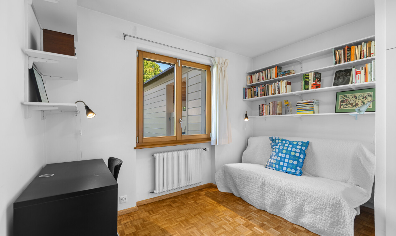 living area featuring radiator heating unit and parquet floors