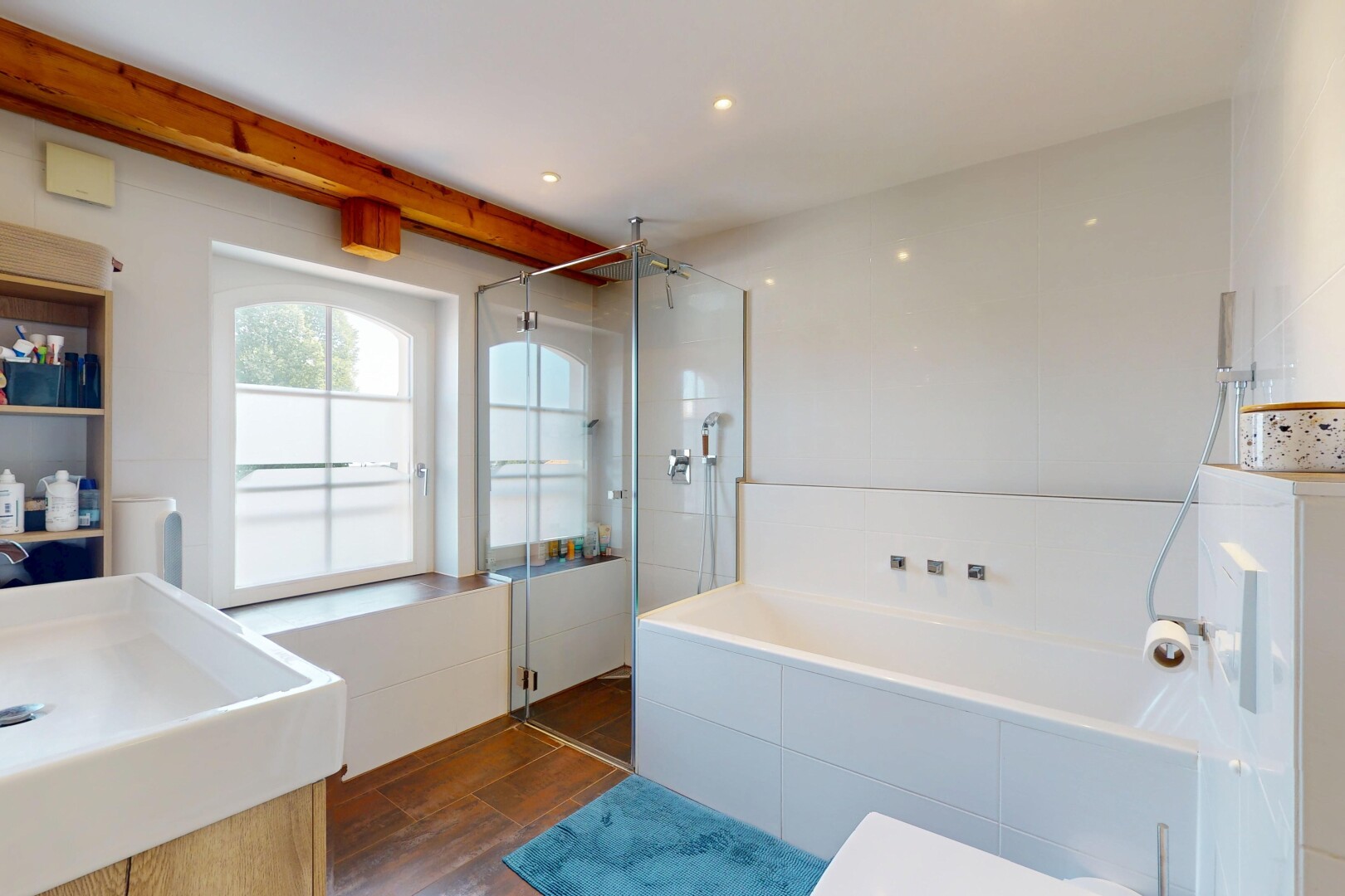 bathroom featuring a shower stall, a garden tub, wood finished floors, and vanity