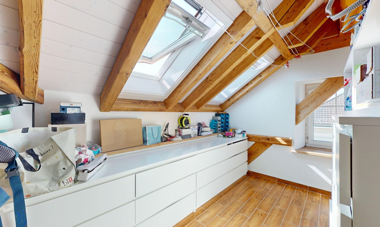 kitchen featuring a skylight, lofted ceiling, and light wood-type flooring