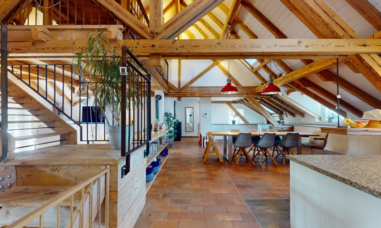 dining space with stairway and high vaulted ceiling