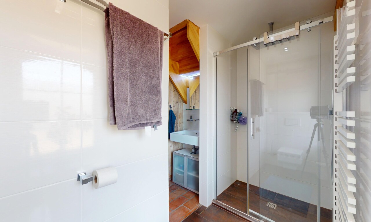 bathroom with a shower stall