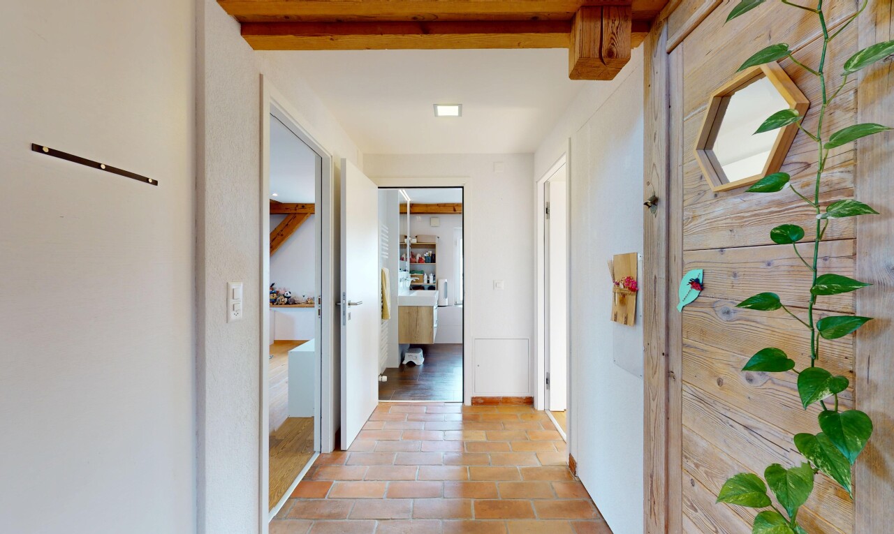 hallway featuring tile patterned floors