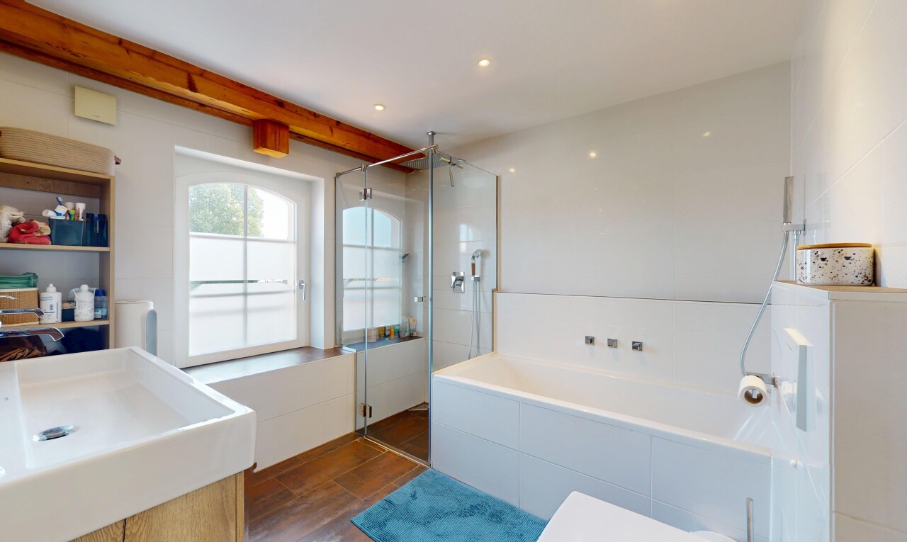 bathroom featuring a shower stall, a garden tub, wood finished floors, and vanity