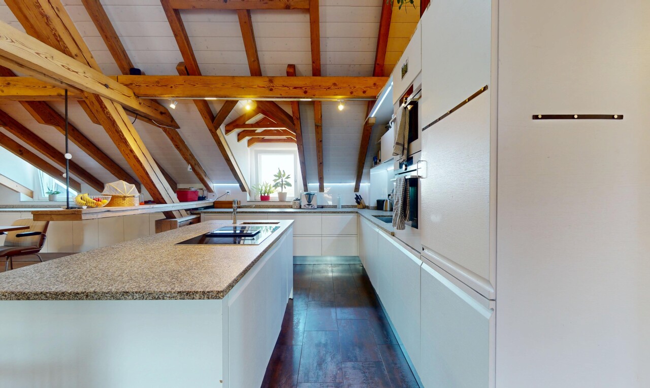 kitchen with white cabinetry, light countertops, dark wood finished floors, and black electric cooktop