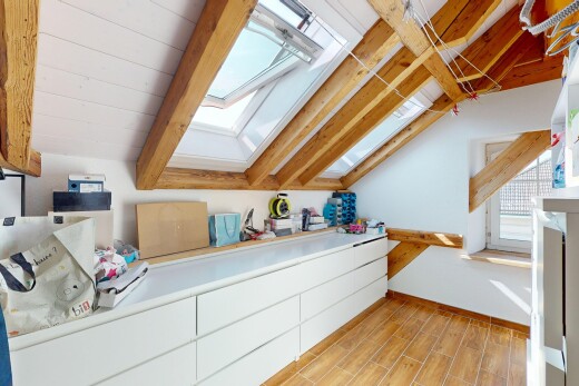 kitchen featuring a skylight, lofted ceiling, and light wood-type flooring