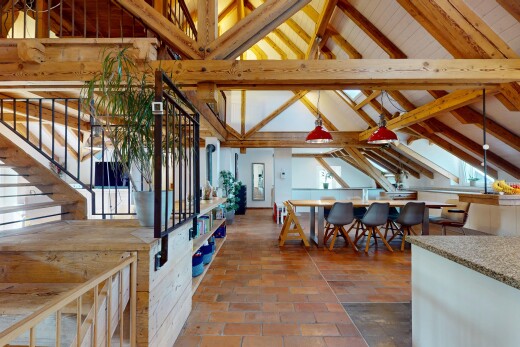 dining space with stairway and high vaulted ceiling