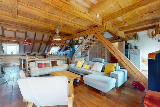 living room with stairs and a wooden ceiling with exposed beams