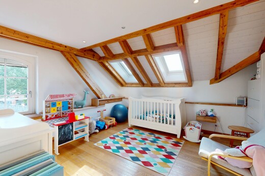 room / bedroom with a skylight and wood finished floors