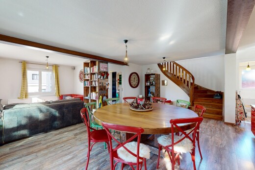 dining area with stairway and wood finished floors