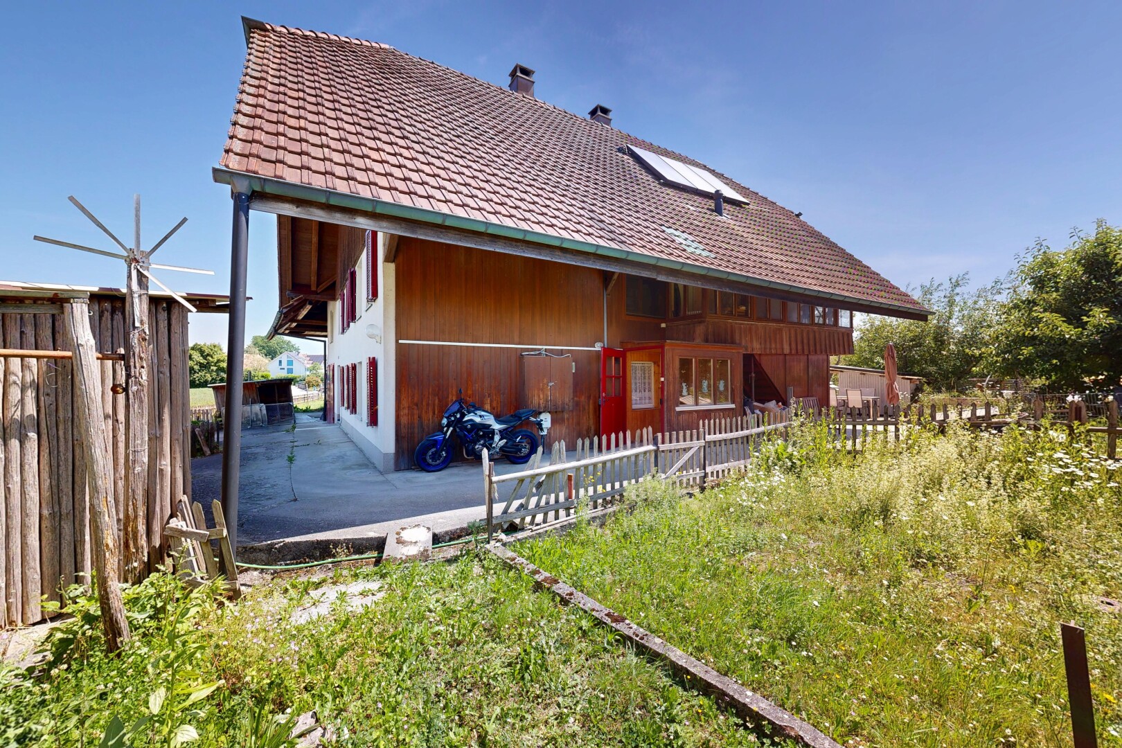 outdoor house with a chimney and a tiled roof