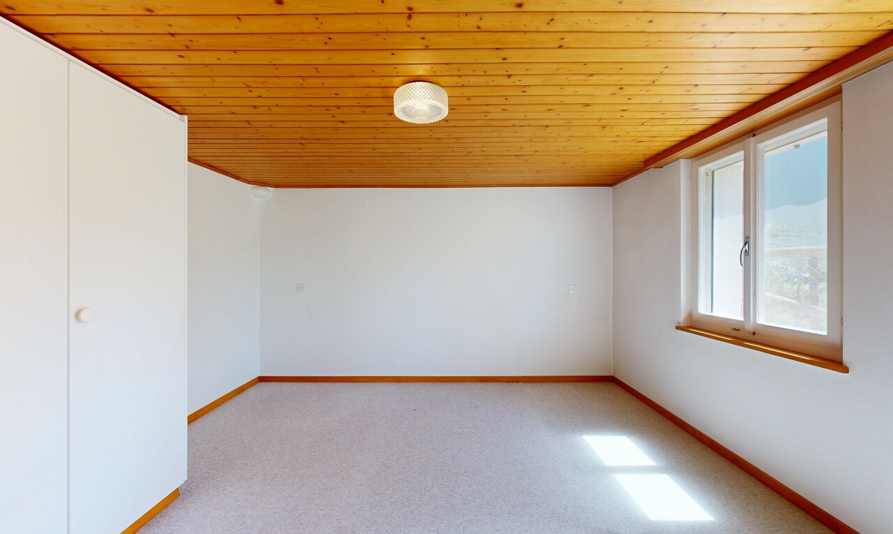 unfurnished room with light carpet and wood ceiling