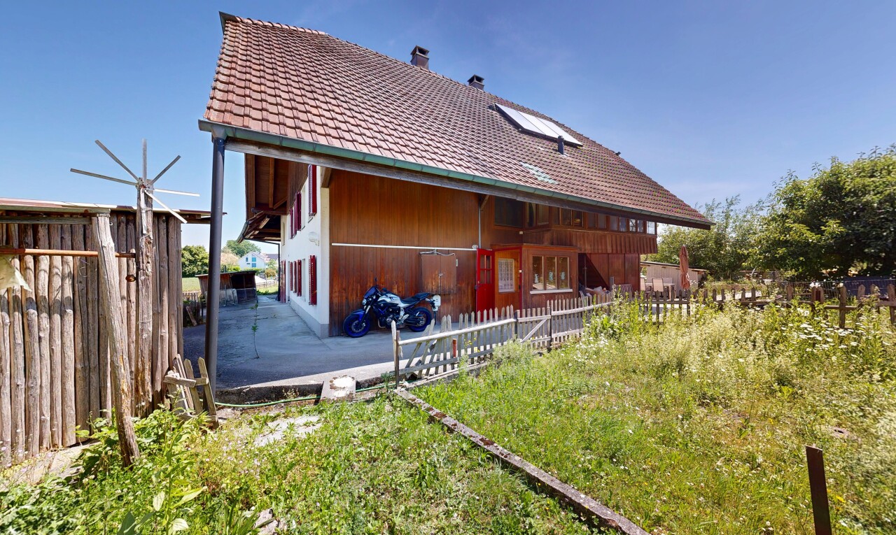 outdoor house with a chimney and a tiled roof