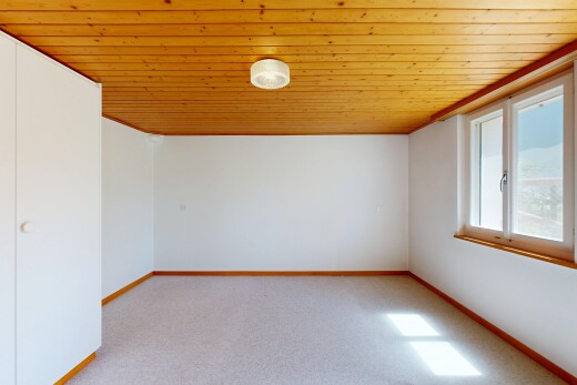 unfurnished room with light carpet and wood ceiling