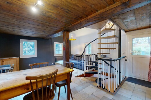 dining room featuring wood ceiling and stairs