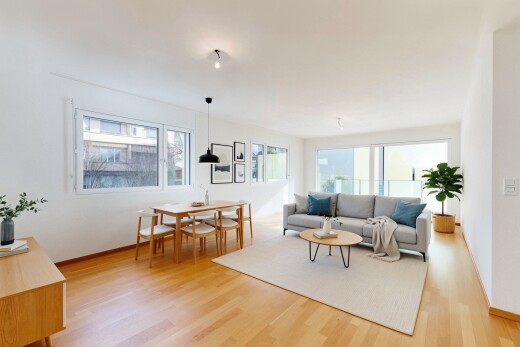 salon / salle à manger avec virtually staged, inside property, sol en finition bois, wood finish floor, et cloison sèche