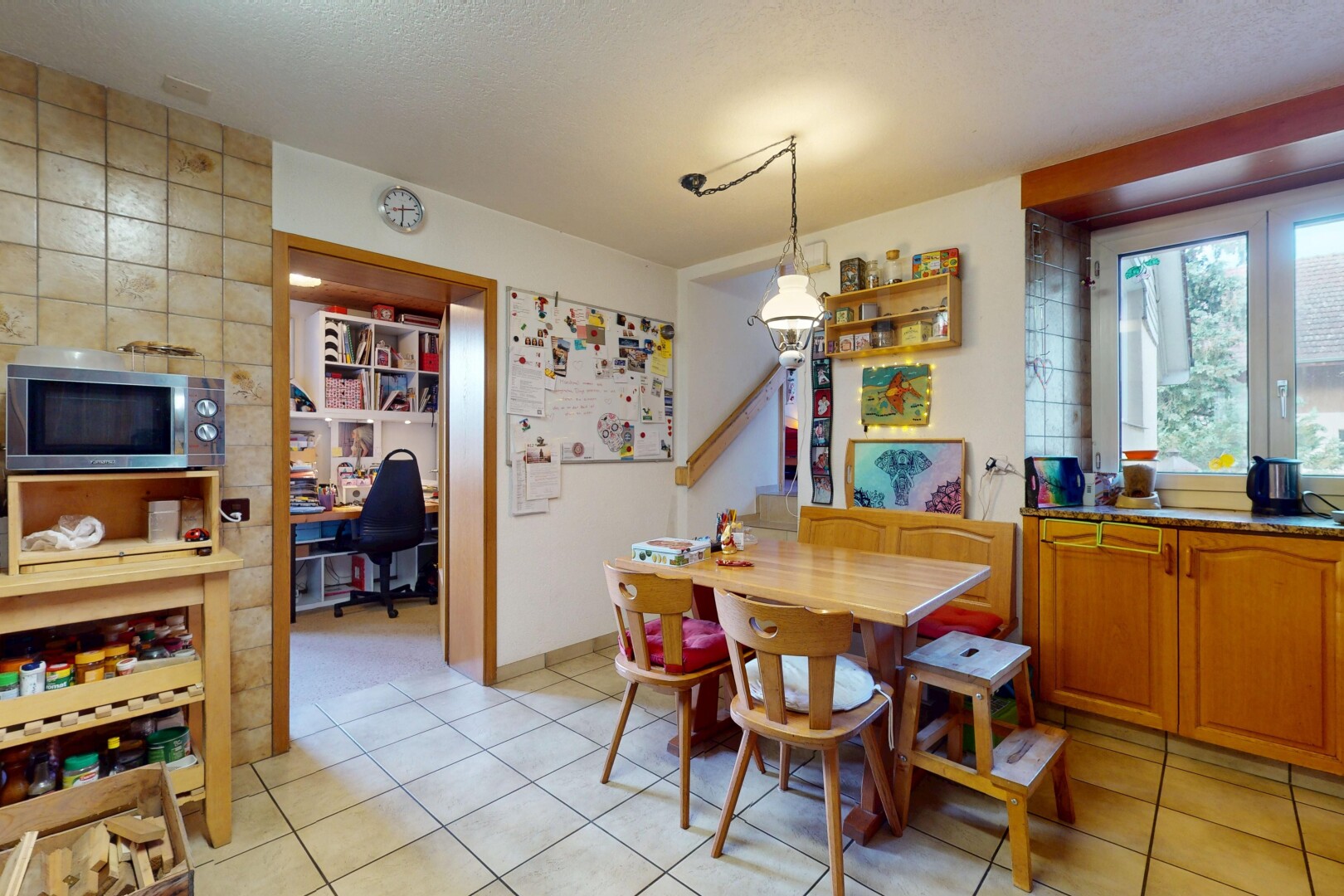 dining room featuring light tile patterned floors and an office area