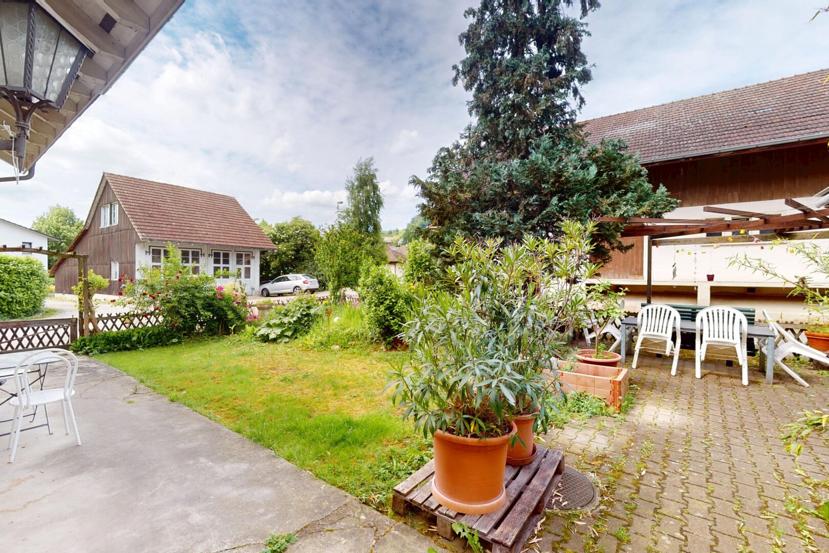 garden with a patio area and outdoor dining area
